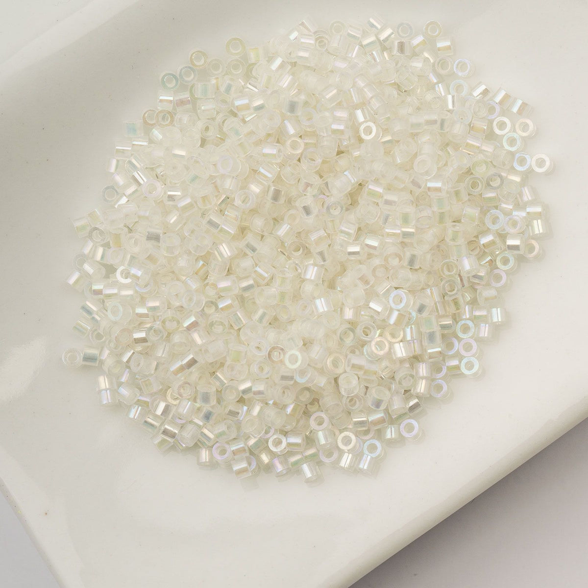 White to Green Glow in the Dark AB - Cylin Bead 11/0 - 25g