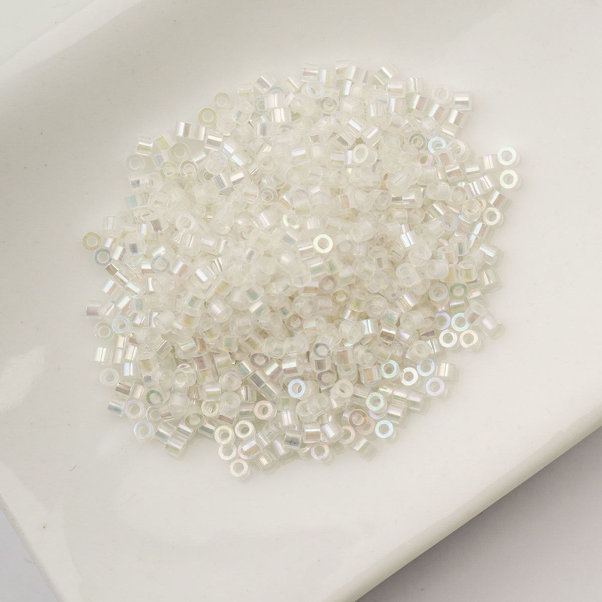 White to Sky Glow in the Dark AB - Cylin Bead 11/0 - 25g